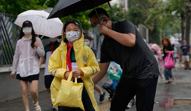 China reduces quarantine for people arriving from abroad- The Week