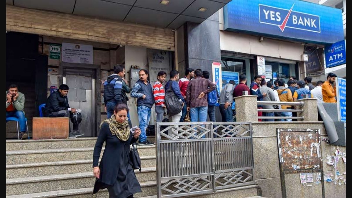 In pics: Customers of Yes Bank line up outside ATMs for cash fearing loss  of deposits