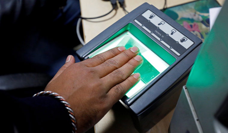 Centre suspends biometric attendance amid COVID surge- The Week