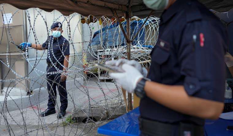 Malaysia imposes near-total lockdown after virus cases ...
