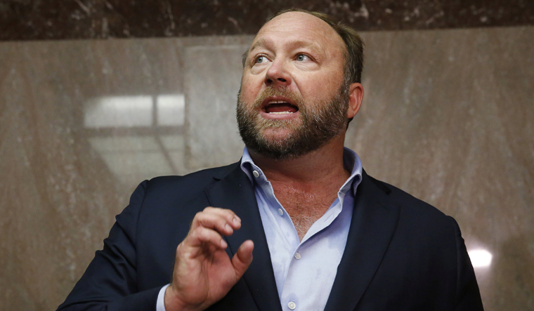 Conspiracy theorist Alex Jones ordered to pay nearly $1 billion for ...